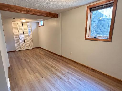 The 3rd bedroom with egress window and new flooring