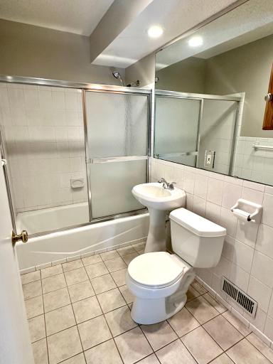 Main level full bath with tile shower and floors