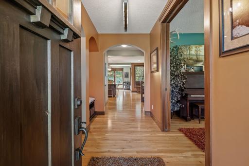 Gorgeous architectural details throughout this home with arched doorways, beautiful hardwood floors and trim.