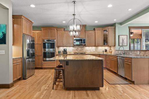 The perfect flow from the kitchen to the living room and dining room, with a massive center island for gathering or production!