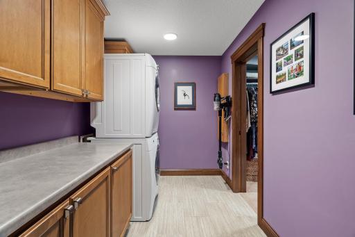 Ultra-convenient laundry has access to hallway and to the primary walk in closet.