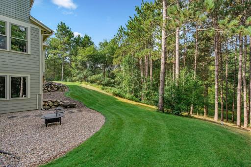 Gorgeously manicured yard separates the house from the massive 12 acres.