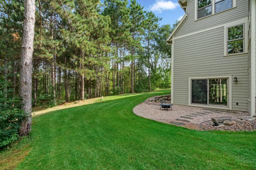 Gorgeously manicured yard separates the house from the massive 12 acres.