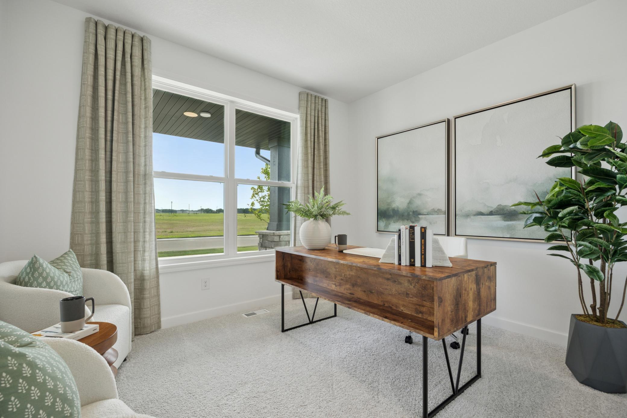 (Photo of a decorated model, actual homes finishes will vary) The main level flex room.