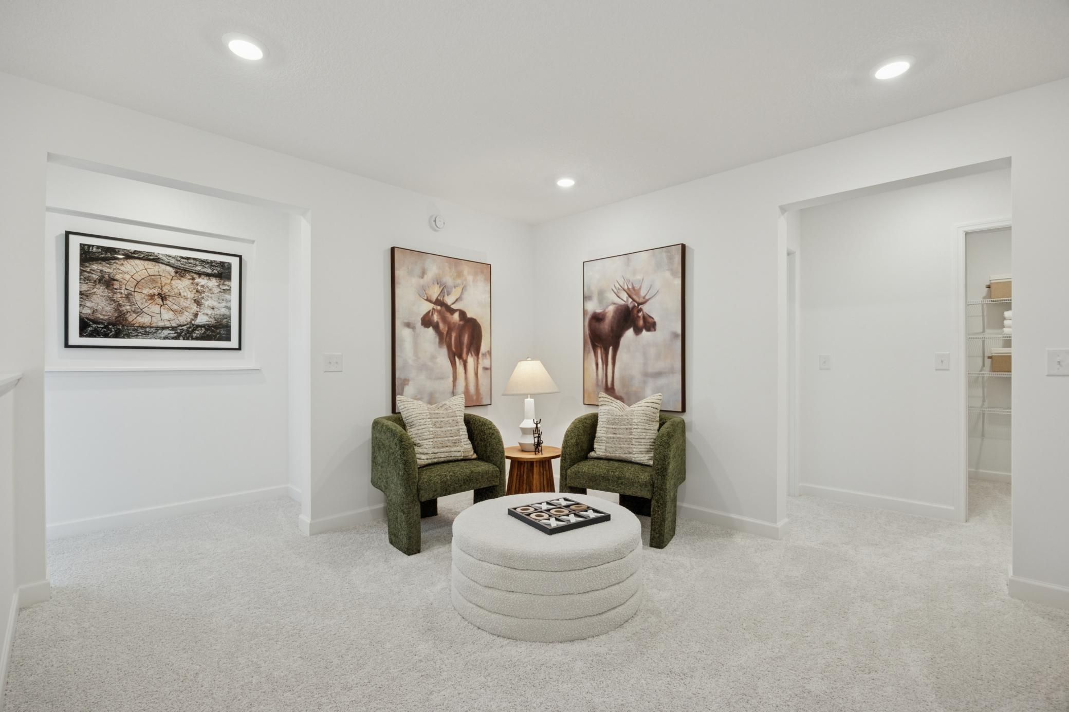 (Photo of a decorated model, actual homes finishes will vary) Relax, play and enjoy in the loft area!