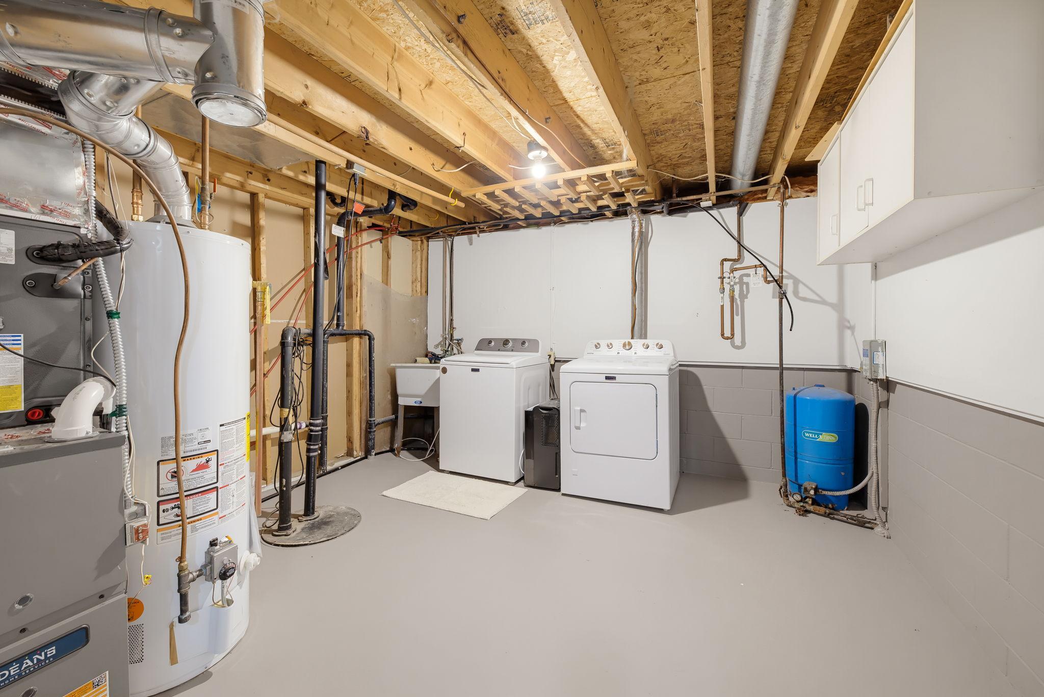 Freshly Painted Laundry Room & Storage Space. New Furnace Recently Insalled.