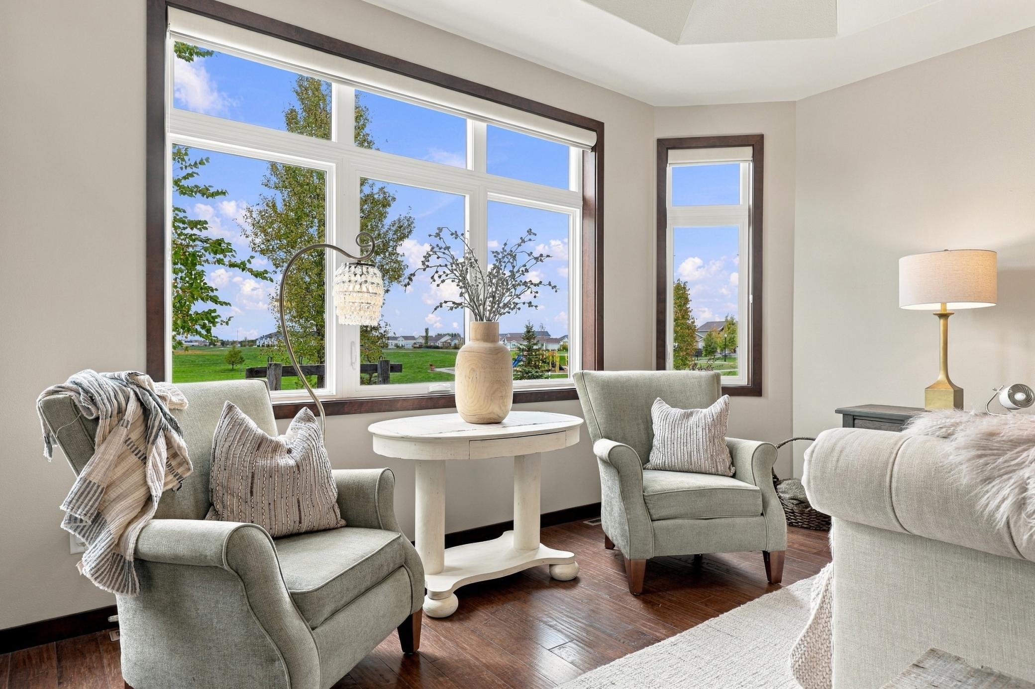 Custom silhouette blinds frame the view towards green space