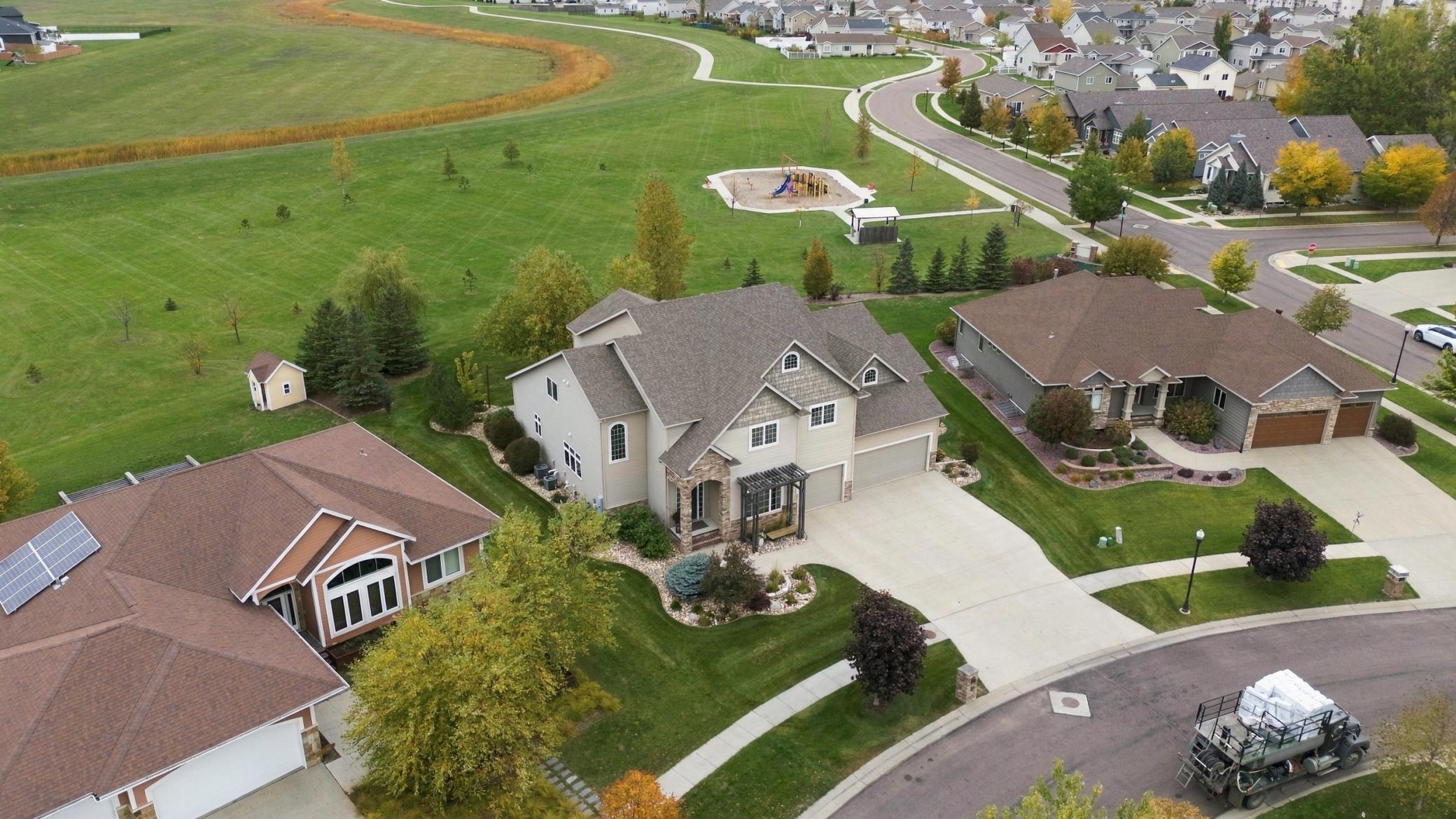 Generous private lot backing green space and park