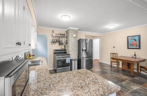 New black stainless appliances add a sleek, modern edge to the kitchen, with a gas range and plenty of prep space that even the serious home cook can appreciate.