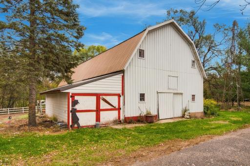 Huge barn with room for stalls, tack room and above has a hockey arena
