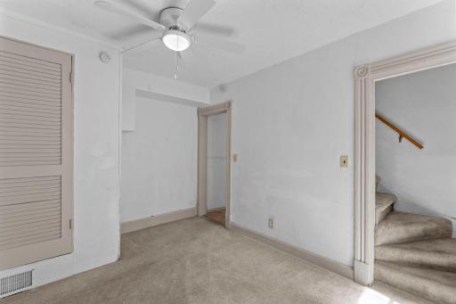 Dining room area with access to the upper level and entry to the kitchen