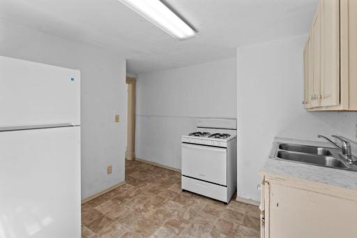Kitchen area with doorway out to the dining area