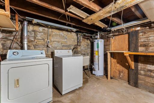 Basement with washer and dryer and utility sink