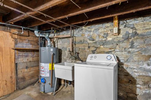 Basement with washer and dryer hookup and utility sink