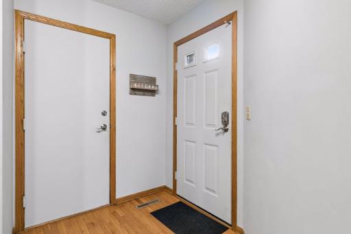 Interior front door on right, door to garage on left