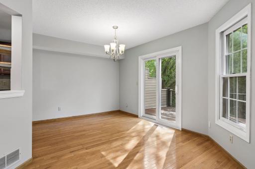 Dining room with sliding glass door out to wood deck