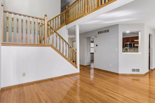 Living room with stairs going up to the upper level