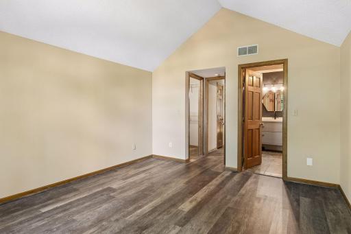 Primary bedroom with access to full bathroom and walk in closet