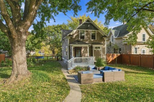 View of the yard and back of the home. Patio set and fire table included in the sale.