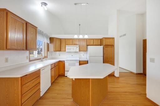 From baking cookies to preparing your favorite meals, your spacious kitchen offers abundant counter space and a center island with plenty of room to create something delicious