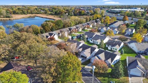 The bird's-eye view of Lake's Edge, where attractive one-level homes, tree-lined surroundings, and nearby Crooked Lake come together to create a welcoming community