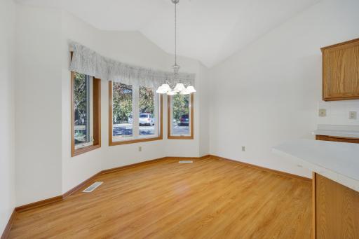 enjoy a leisurely breakfast, your morning coffee, or a casual meal in this cheerful, light-filled dining nook just off the kitchen