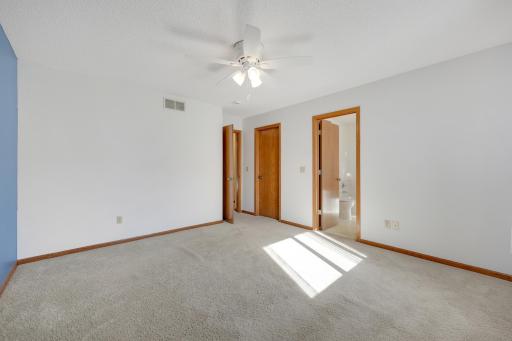 At the end of the day, there's nothing quite like the comfort of your own private space. This spacious primary bedroom features an en-suite bathroom walk-in closet, with everything you need close at hand