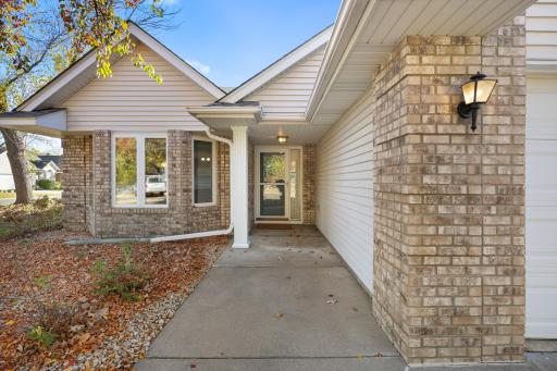 A welcoming covered front entry offers shelter from the elements and easy access to the home