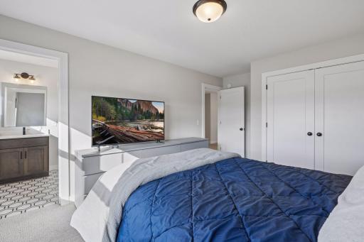 Second bedroom on the upper level with shared bathroom