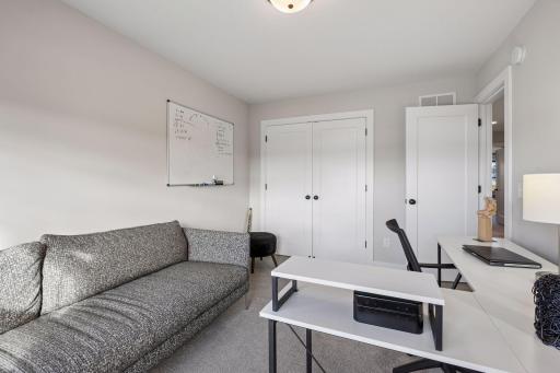 Third bedroom on the upper level with shared bathroom