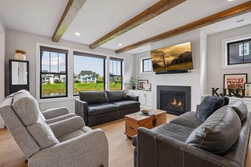 Step over to the living room with beam ceilings and tons of natural light