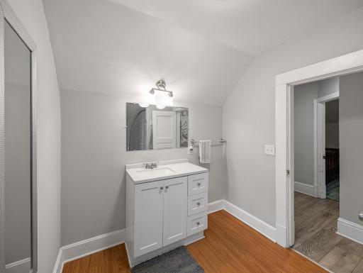 A bright bathroom with a clean, simple look and a spacious vanity for everyday convenience.