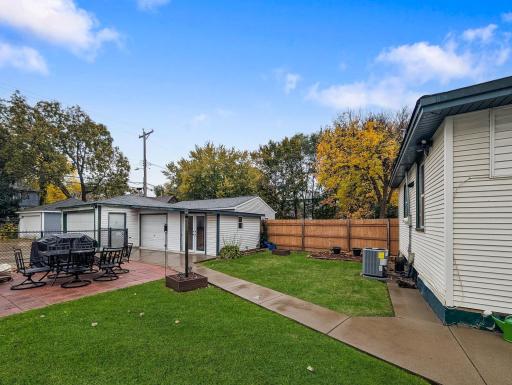 Enjoy a fenced backyard with a patio area and green space to make the most of sunny afternoons and time outdoors.