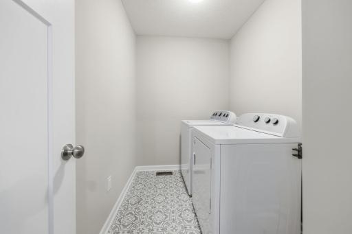 Laundry between the bedrooms, upper level. Get your wash done and put away in no time and no stairs. Win!