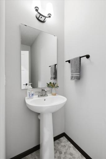 Convenient 1/2 Bath completes the main level