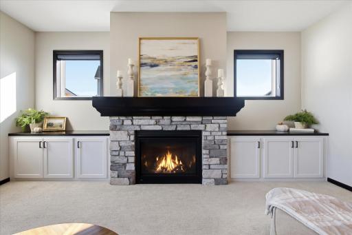 Custom built-in storage and gas fireplace in main level Great Room