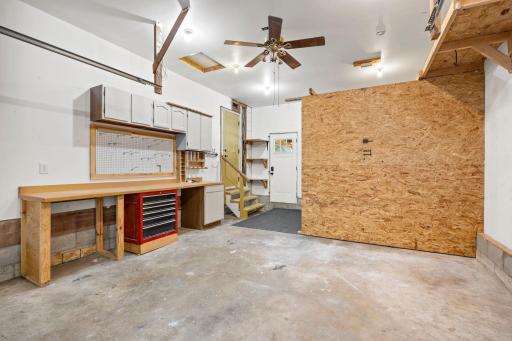 The oversized 1-stall heated garage is a standout feature, complete with a workbench and additional storage space.