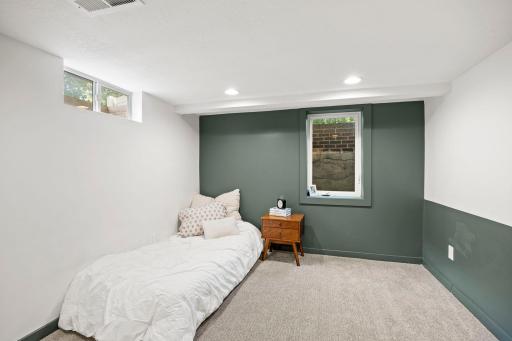 The lower level adds an additional bedroom with carpeting and an egress window. A beautifully remodeled Â¾ bathroom nearby.
