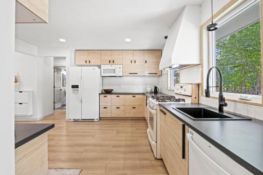 The open layout provides a comfortable space for everyday meals and entertaining, while the eat-in area offers plenty of room for a dining table.