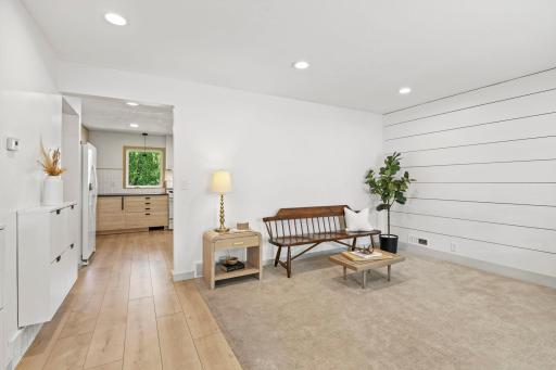 As you enter, youâre greeted by a spacious front living room filled with natural light from the large front-facing window.