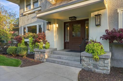 Gracious front entry with original door.