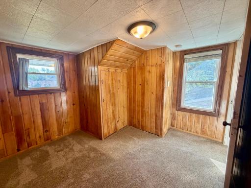 Bedroom 1 features knotty pine throughout