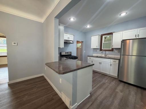 The breakfast bar is the perfect spot for a quick bite or conversation in the kitchen