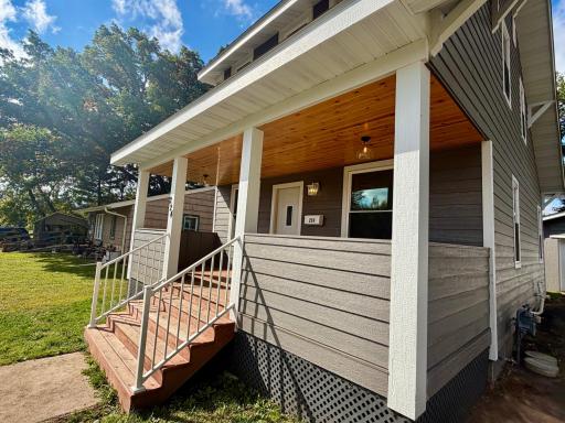 Check out that knotty pine ceiling in the porch