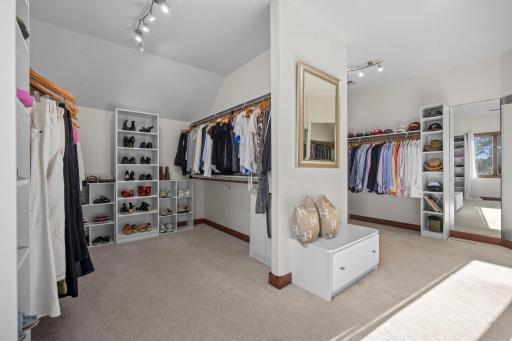 You won't have to worry about room for your clothes with two sided walk-in closet