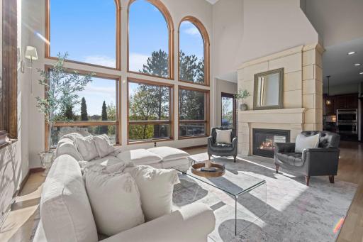 Great room overlooks deck with river bluff views