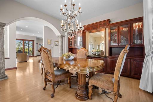 Formal dining room with built-in cherry hutch with backlighting