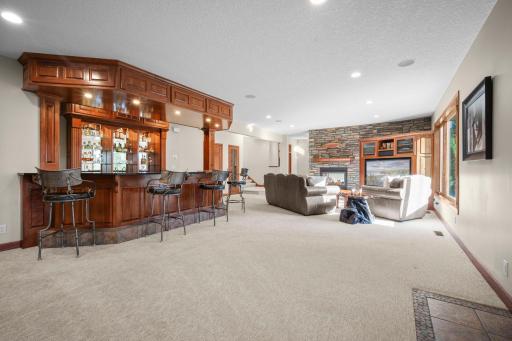 Abundant entertainment space with wet bar and large entertainment room