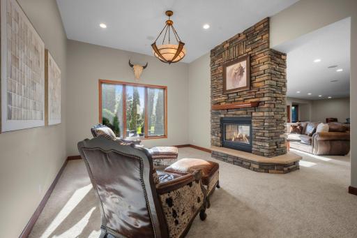 Down stairs you can enjoy a book by the fire in this sitting room