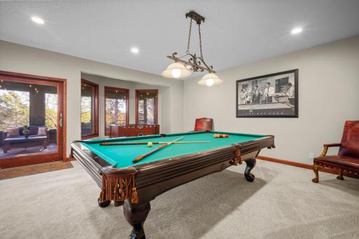 Enjoy game night with plenty of space for foosball. pool or cards